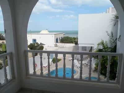 Room with balcony on sea and pool